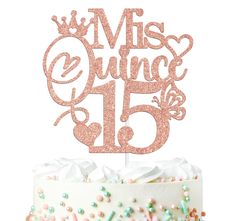 a cake with pink and green sprinkles on it that says miss quince