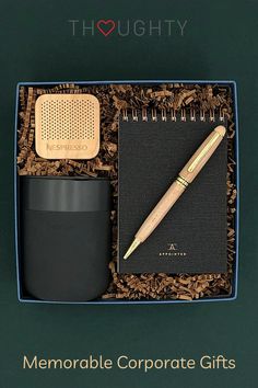 there is a notepad, pen and cup in a box with the words thoughty on it