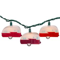 three red and white camper trailer lights hanging from a green wire against a white background