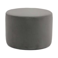 a grey ottoman sitting on top of a white floor