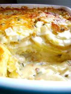 a casserole dish with cheese and spinach