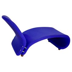 a blue chair that is shaped like an elephant's tail and has wheels on it