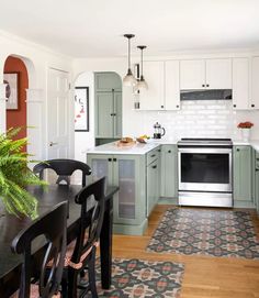 the kitchen is clean and ready to be used for cooking or dining room furniture, as well as other appliances