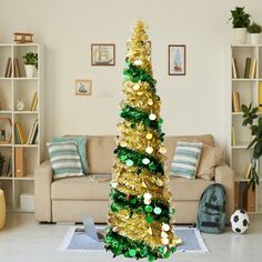 a decorated christmas tree in the middle of a living room