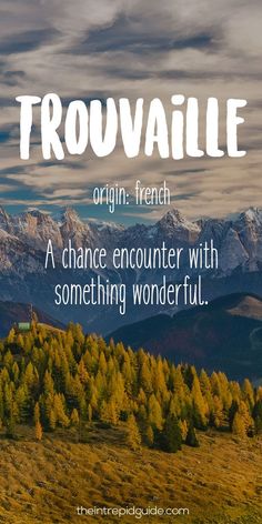 the words trouvallie are written in white on top of an image of mountains