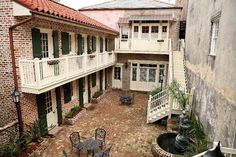 an outdoor courtyard with tables and chairs