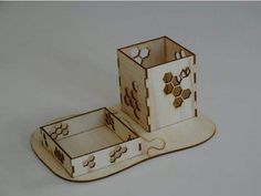 a wooden puzzle box with two sections cut out to look like an animal's house