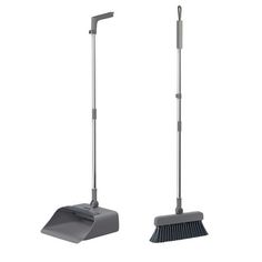 two brooms and a dustpan are shown in this image, one is gray