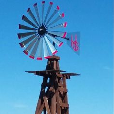 a windmill on top of a wooden pole