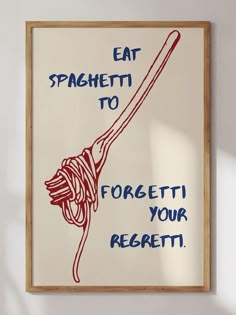 an art piece hanging on the wall with words that read eat spaghetti to forget it your rezetti