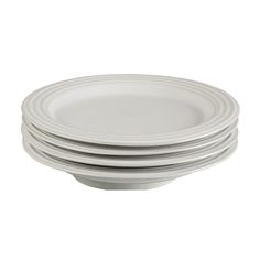 six white plates stacked on top of each other