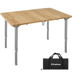 a wooden table with two metal legs and a black bag next to it on a white background