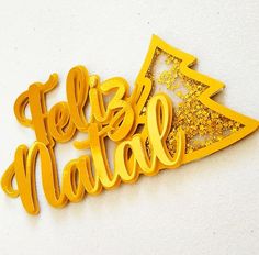 there is a yellow metal sign that says feliz nabil