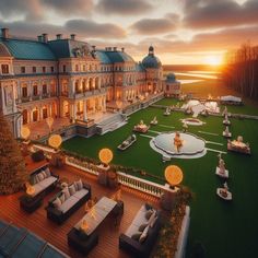 an aerial view of a large mansion at sunset