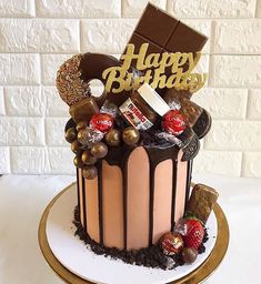 a birthday cake decorated with chocolate and candies