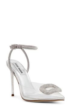 A sparkly rhinestone strap winds up and around the ankle of this pointy-toe stiletto pump topped with a matching decorative buckle. 4 1/4" heel (size 8.5) Adjustable ankle strap with buckle closure Synthetic upper, lining and sole Imported Glamorous Silver Pointed Toe Heels, Steve Madden Rhinestone Heels, Luxury Silver-studded Pointed Toe Heels, Silver Pointed Toe Heels With 4-inch Heel, Metallic Silver Heels With Pointed Toe And 4-inch Heel, Ankle Strap Pumps, Stiletto Pumps, Women's Pumps, Pump Shoes