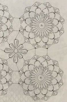 a drawing of four circular flowers on white paper