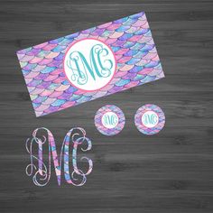 the monogrammed mermaid tail with two matching stickers is shown in blue, pink and