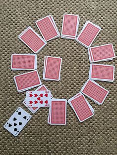 playing cards laid out in a circle on the floor