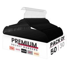 a pack of 50 black velvet hangers on top of a white box with the label for premium velvet hangers