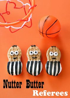 three cookies shaped like basketball players with the words nutter butter referee above them and an orange basketball