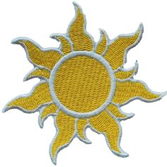 a yellow and white embroidered patch with the sun in it's center on a white background