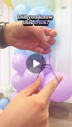 someone is holding balloons and stringing them with the words did you know this trick?