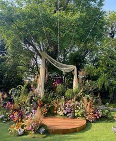 an outdoor garden with flowers and trees