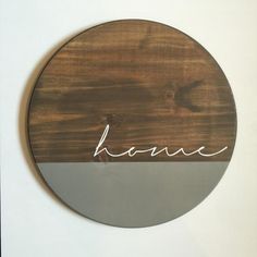 a round wooden sign with the word havan written in cursive writing on it