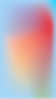 a blurry image of an orange and blue background