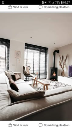 a living room filled with furniture and a fire place