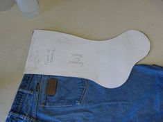 a piece of paper that has been cut out to look like a pair of jeans