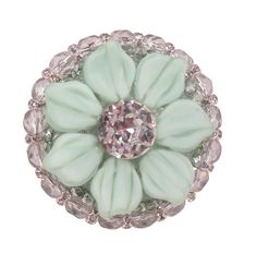 an image of a ring with green flowers and crystal stones on the front, set in silver tone