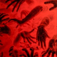 an image of many different hand prints on a red background with black and white ink