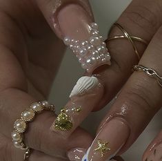 the manies are decorated with pearls and other things to wear on their nails for an elegant touch