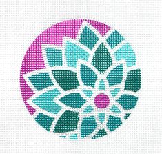 a cross stitch pattern with blue and pink flowers on the center, as well as green leaves