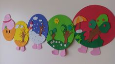 the paper cut out animals are lined up on the wall