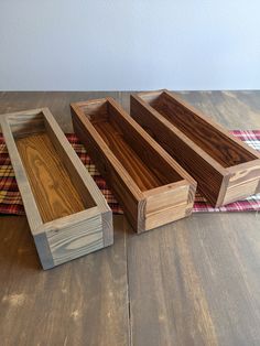 three wooden trays sitting on top of a table next to each other with the words aged barrel walnut, american walnut and red oak