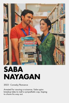 a man and woman standing next to each other in front of a book shelf filled with books