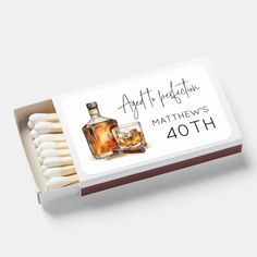 matchbox with matches and an image of a bottle of whiskey