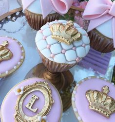 cupcakes decorated with gold and pink icing