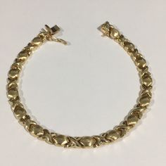 Beautiful 14k Yellow Gold Women's Puffed Xo Bracelet. Weight: 8.1g. Length: 6.5". Width: 5mm. In Excellent Condition!!! Vintage Yellow Gold Plated Bracelet, 14k Yellow Gold Tarnish-resistant Cuban Link Bracelet, Tarnish Resistant Gold-plated Yellow Gold Bracelet, Vintage Yellow Gold Link Bracelets, Vintage Yellow Gold Tarnish-resistant Bracelet, Womens Bracelets, Womens Jewelry Bracelets, Jewelry Bracelets, Yellow Gold