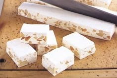 several pieces of food sitting on top of a cutting board