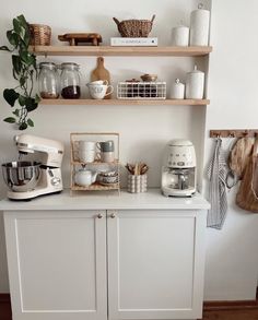 the kitchen is clean and ready to be used as a coffee bar or breakfast bar