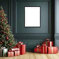 a christmas tree and presents in front of a wall with a white frame on it