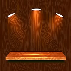 three spotlights on a wooden shelf in the dark