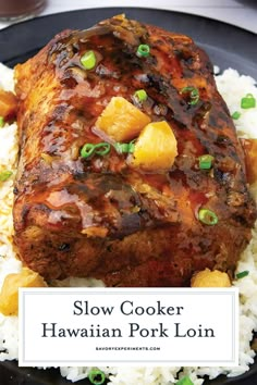 slow cooker hawaiian pork loin with rice and green onions on a black plate