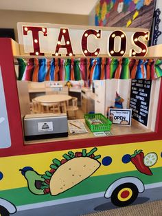 a taco truck is decorated with lights and decorations