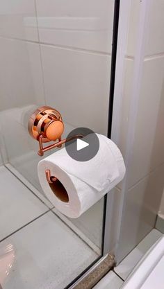 a roll of toilet paper sitting on top of a metal holder