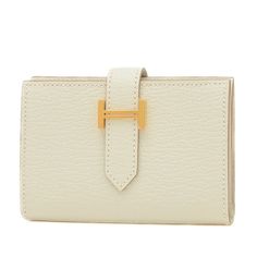 Used Hermes Bearn Bi-Fold Wallet Chevre Mushroom B Engraved (Sku: Gzl12pm1) === General === Brand : Hermes === Design === Type : Wallet (Bi-Fold) Gender : Women Material : Chevre Leather Color : White === Size === Size (Hxwxd) : 7cm X 10cm / 2.75'' X 3.93'' === Included Items === Accessories : Box Accessories Notice : Before Purchasing, Please Refer To The Images Of The Accessories Included With The Item. === Condition === Condition : Opened (Never Used) Ranking : Rank Ns Never Used / Display It Classic Beige Wallets With Gold-tone Hardware, Classic Cream Wallet For Formal Occasions, Elegant Tan Bifold Wallet, Elegant Tan Wallets For Business, Elegant Beige Formal Wallet, Beige Business Wallet, Elegant Tan Wallet For Formal Occasions, Designer White Wallets For Formal Occasions, Formal Cream Rectangular Wallet